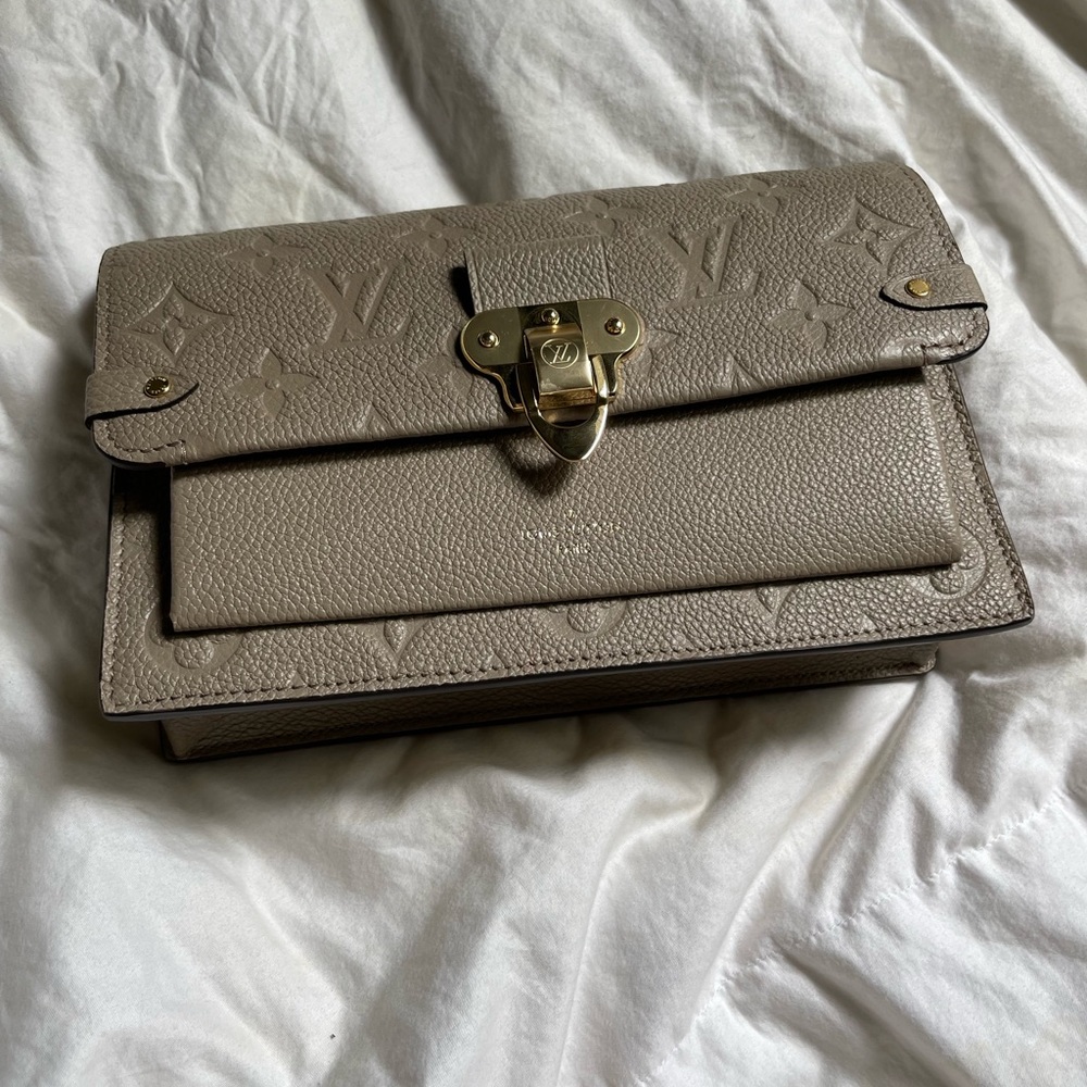 Louis Vuitton gold and beige LV logo vavin clutch w/gold chain detail, brand new